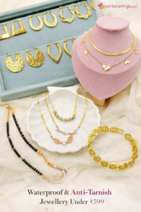Waterproof and anti-tarnish gold-tone jewellery collection featuring hoop earrings, drop earrings, statement earrings, layered necklaces, evil eye necklace, mangalsutra, bracelet, and golden chains displayed on elegant fabric and velvet stands from PinkEarrings.com