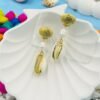 Stylish beachwear jewelry featuring a delicate multiple  shell, natural pearl, and coral charm