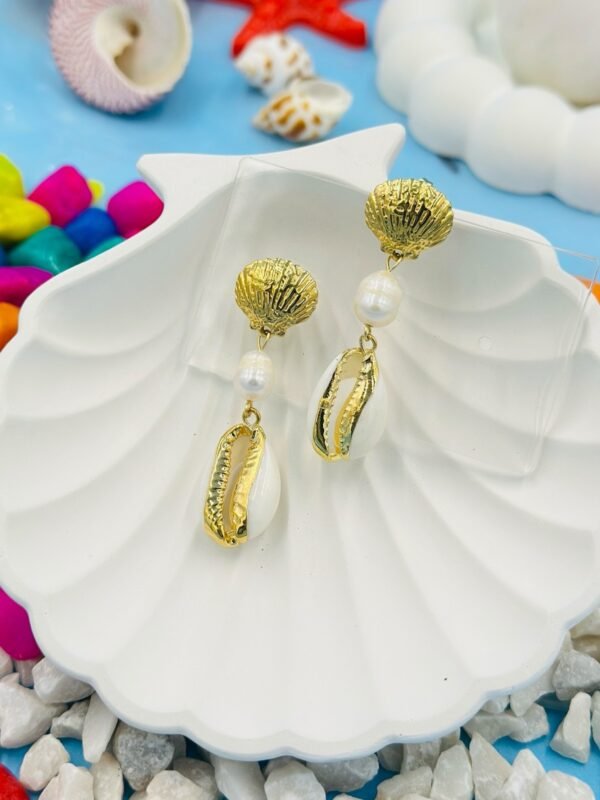 Stylish beachwear jewelry featuring a delicate multiple  shell, natural pearl, and coral charm