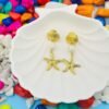 Coastal-inspired gold starfish and pearl long earrings, perfect for beachwear and tropical vacations.