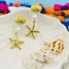 Coastal-inspired gold starfish and pearl long earrings, perfect for beachwear and tropical vacations.