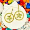 Golden hooped dangler earrings with a delicate flower centerpiece – crafted from hypoallergenic stainless steel for comfort and style