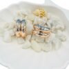 Stylish rose-gold half hoop earrings studded with sparkling diamonds