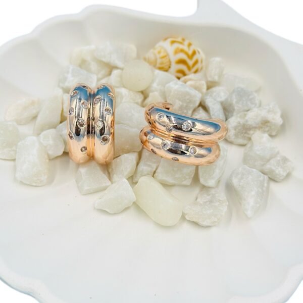 Stylish rose-gold half hoop earrings studded with sparkling diamonds
