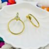 Elegant golden hoop danglers crafted from stainless steel, featuring a sparkling diamond