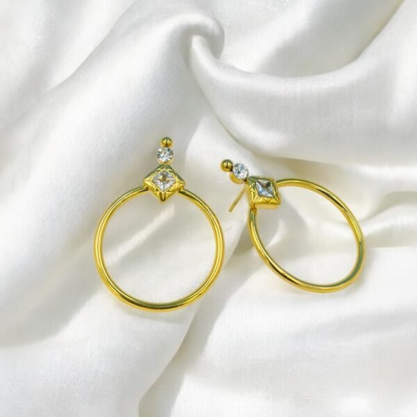 Elegant golden hoop danglers crafted from stainless steel, featuring a sparkling diamond