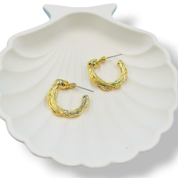 Classic small gold hoop earrings with a sleek, minimalist design