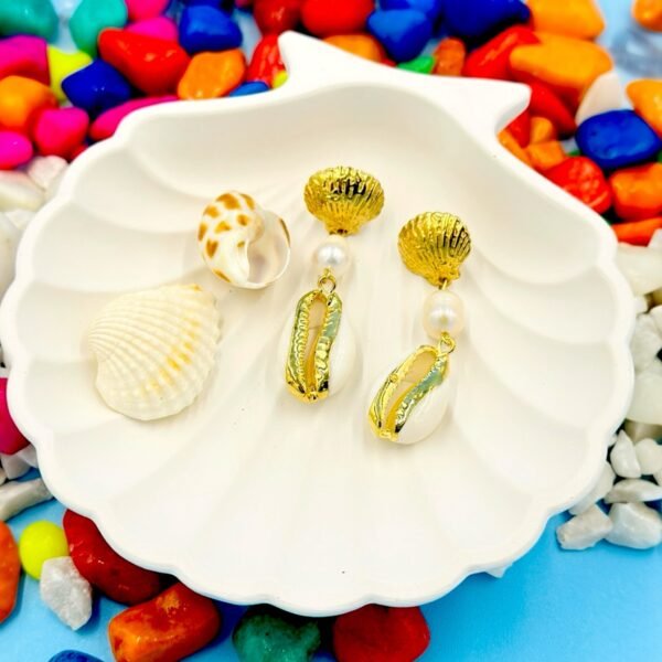 Stylish beachwear jewelry featuring a delicate multiple  shell, natural pearl, and coral charm
