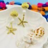 Coastal-inspired gold starfish and pearl long earrings, perfect for beachwear and tropical vacations.