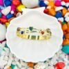 Add a pop of color and love to your wrist with this gold bracelet featuring vibrant multi-colour heart-shaped diamonds