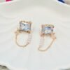square diamond rose gold earrings with a dainty drop chain design, embellished with shimmering diamond