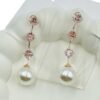 Stylish long square diamond chain accented with a radiant pearl Earrings