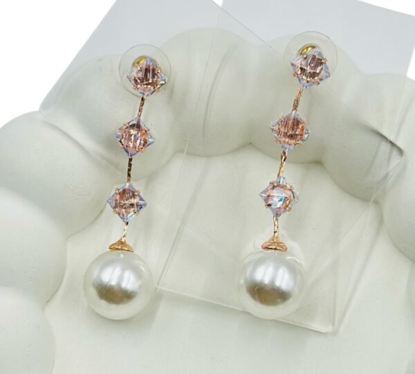 Stylish long square diamond chain accented with a radiant pearl Earrings
