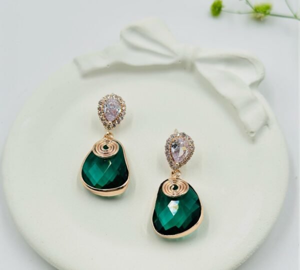 Contemporary-shaped earrings featuring colorful accents and diamonds