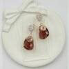 Contemporary-shaped earrings featuring colorful accents and diamonds