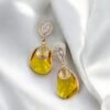 Contemporary-shaped earrings featuring colorful accents and diamonds
