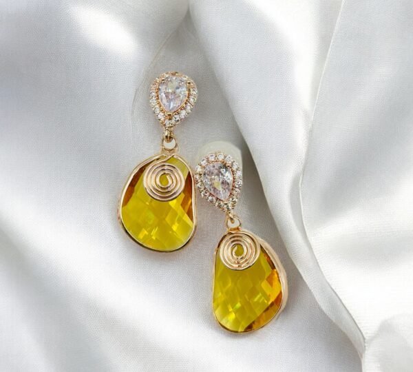 Contemporary-shaped earrings featuring colorful accents and diamonds