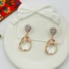 Contemporary-shaped earrings featuring colorful accents and diamonds