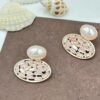 Oval drop earrings featuring dazzling diamonds and a radiant pearl