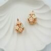 Romantic flower basket hoops featuring soft nude floral accents