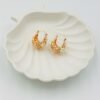 Romantic flower basket hoops featuring soft nude floral accents