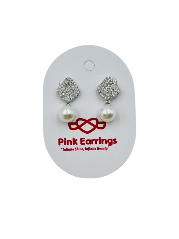 Diamond-studded drop earrings with a radiant pearl