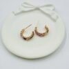 Stylish half hoop earrings featuring colorful square-cut diamonds