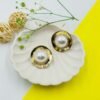 Bold Aura Pearl Dome Studs – Sculpted Gold Frame with Oversized Pearl Center