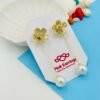 Golden Bloom Pearl Thread Earrings – Floral Stud with Dangling Pearl