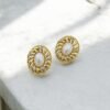 Golden Swirl Pearl Studs – Sculpted Gold Frame with Crystal & Pearl Accent
